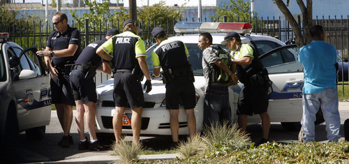 Steve Grifffin  |  The Salt Lake Tribune

Salt Lake City -   Salt Lake CIty police officers take a man into custody after he allegedly sold drugs to an undercover officer near Pioneer Park in Salt Lake City Thursday Sep 24, 2009.