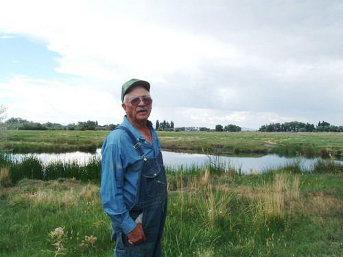 Joe Baird  |  The Salt Lake Tribune 

Cecil Garland, stands near a natural spring on the rich grazing land  he has developed over 3 decades in this photo from 2005.