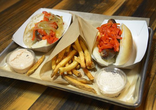 Rick Egan  |  The Salt Lake Tribune

Curry Sausage and Mediterranean sausage with sautéed red peppers, and Belgian Fries, at the Beer Bar, 161 E. 200 South in Salt Lake.