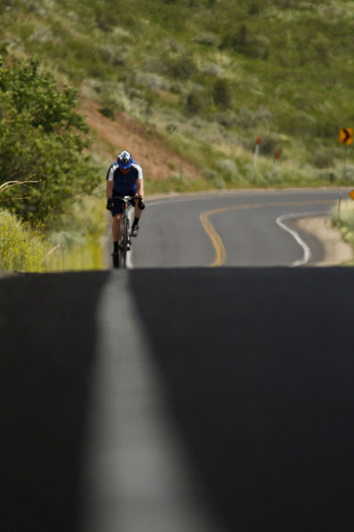 Trent Nelson  |  The Salt Lake Tribune
Cyclist Paul Clayton makes his way over the top of Emigration Canyon Road in 2012 in Salt Lake City.