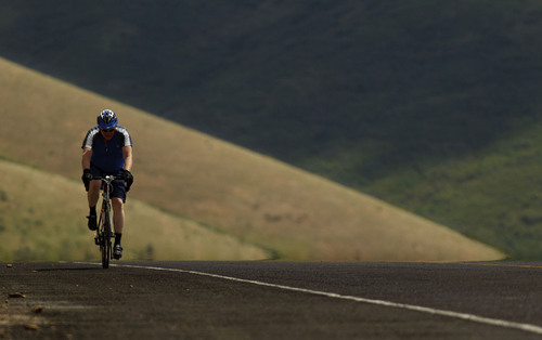 Trent Nelson  |  The Salt Lake Tribune
Cyclist Paul Clayton makes his way over the top of Emigration Canyon Road in June 2012 in Salt Lake City.