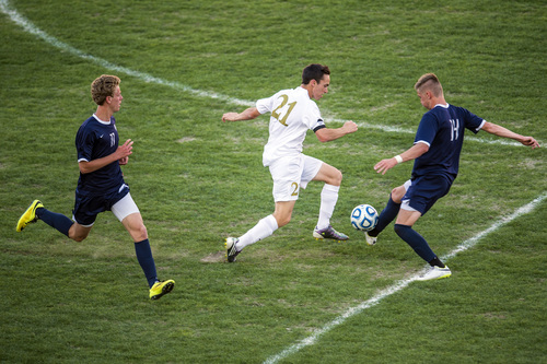 Chris Detrick  |  The Salt Lake Tribune
Skyline's Jared Hickey (14) Logan's Andy Phillips (21) and Skyline's Brigham Jackson (11) go for the ball during the 4A Championship game at Rio Tinto Stadium Thursday May 22, 2014. Skyline defeated Logan 3-0.