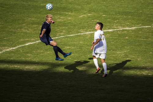 Chris Detrick  |  The Salt Lake Tribune
Skyline's Quinn Dunford (3) and Logan's Jonny Guadarrama (27) go for the ball during the 4A Championship game at Rio Tinto Stadium Thursday May 22, 2014. Skyline defeated Logan 3-0.