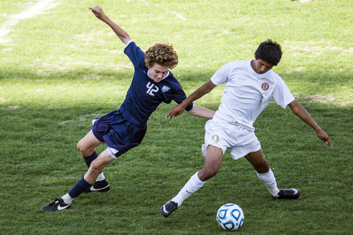 Chris Detrick  |  The Salt Lake Tribune
Skyline's Nate Jensen (42) and Logan's Beto Rincon (9) go for the ball during the 4A Championship game at Rio Tinto Stadium Thursday May 22, 2014. Skyline defeated Logan 3-0.
