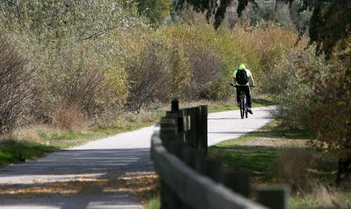 Steve Griffin  |  Tribune file photo
Salt Lake County residents seem to like scenes like this: A biker making his way down a Jordan River Parkway trail near 10000 South in South Jordan.