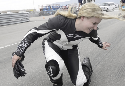 Rick Egan  |  The Salt Lake Tribune

Chantel Galloway, demonstrates what it was like on her two-up Superbike ride with pro Superbike racer, Chris Ulrich, at Miller Motorsports Park, Friday, May 23, 2014