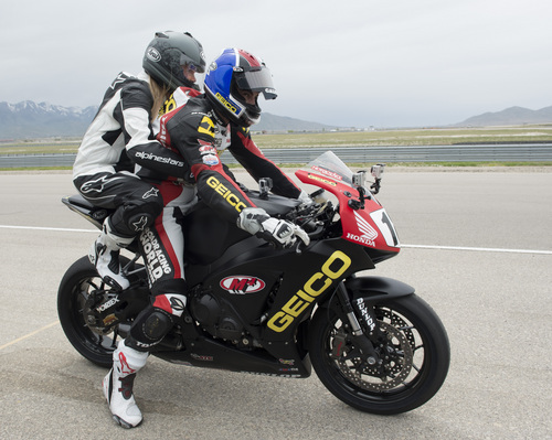 Rick Egan  |  The Salt Lake Tribune

Kristen Nunez, of Fox 13, hops on board for a two-up ride with pro Superbike racer Chris Ulrich at Miller Motorsports Park, Friday, May 23, 2014.