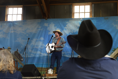 Scott Sommerdorf   |  The Salt Lake Tribune
Troy Ross sings at the 10th Annual Cowboy Poetry and Western Music Festival at the Fielding Garr Ranch at Antelope Island State Park, Saturday, May 24, 2014.