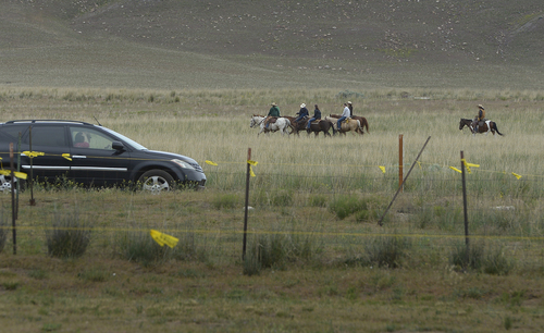 Scott Sommerdorf   |  The Salt Lake Tribune
Past contrasts with present as visitors to the 10th Annual Cowboy Poetry and Western Music Festival at the Fielding Garr Ranch at Antelope Island State Park, drive past a group of cowboys out for a ride, Saturday, May 24, 2014.
