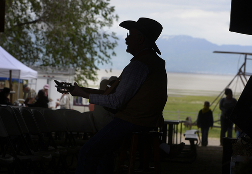 Scott Sommerdorf   |  The Salt Lake Tribune
David Anderson sings at the 10th Annual Cowboy Poetry and Western Music Festival at the Fielding Garr Ranch at Antelope Island State Park, Saturday, May 24, 2014.