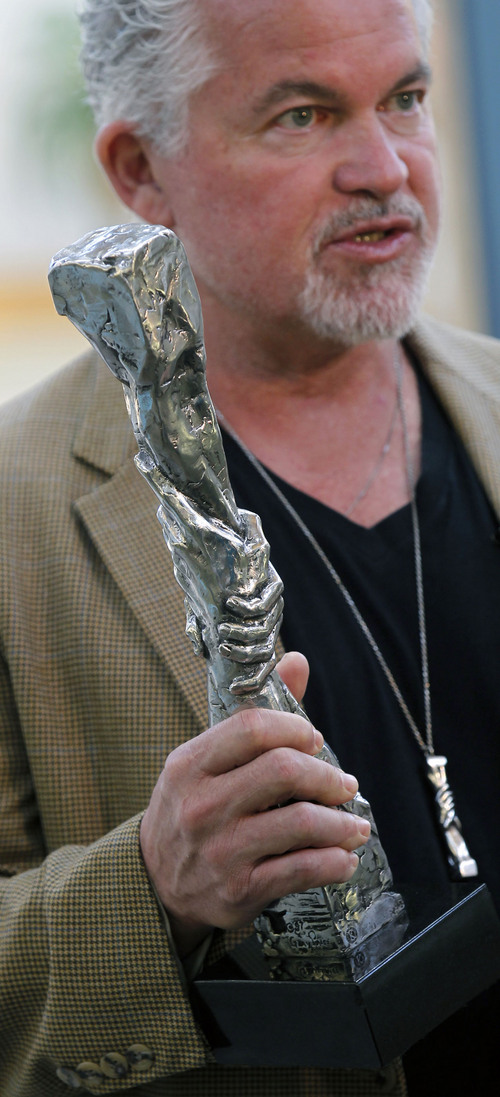 Al Hartmann  |  The Salt Lake Tribune
Sculptor Gary Lee Price holds a model of the Statue of Responsibility" at an  unveiling a 15-foot protype of the monument at Utah Valley University in 2013.