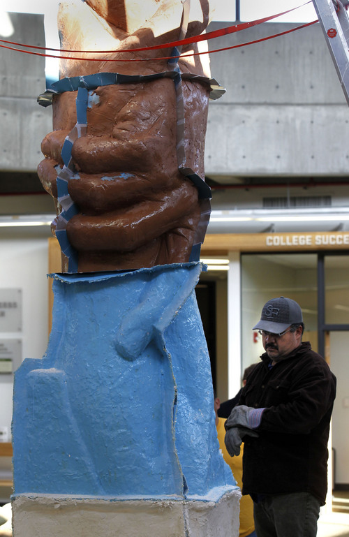 Al Hartmann  |  The Salt Lake Tribune
Artisan Sergio Blanco prepares to remove a bottom section of the working mold for sculptor Gary Lee Price's 15-foot protype of the "Statue of Responsibility" at Utah Valley University in March 2013.