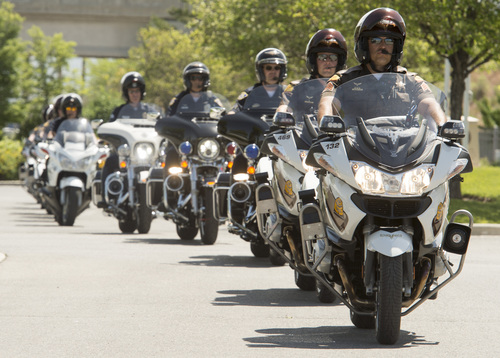 Rick Egan  |  The Salt Lake Tribune

Members of the Utah Highway Patrol, and other police agencies and civilian riders  rally in local news media outlet parking lots to share the latest tools aimed at reducing Utah motorcycle fatalities, Thursday, May 29, 2014