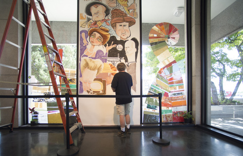 Rick Egan  |  The Salt Lake Tribune
Salt Lake Tribune editorial cartoonist, Pat works on a mural at the Leonardo on Friday. Bagley's creation was unveiled at a ceremony on Saturday.