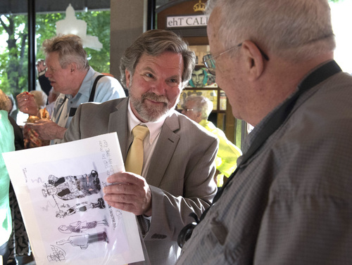Rick Egan  |  The Salt Lake Tribune
Pat Bagley signs a print for David Eccles, during a reception "An Evening With Pulitzer Finalist, Pat Bagley" at the Leonardo, celebrating 35 years of political cartoons on Saturday.