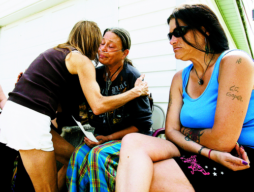 Leah Hogsten  |  The Salt Lake Tribune

South Ogden resident Teressa Baird, left, stopped by to hug and give her condolences to Ruth Serrano, center, mother of Army Staff Sgt. Kurt Curtiss and his sister Lynn Burr on Aug. 28, 2009, after hearing the news of the soldier's death three days earlier.