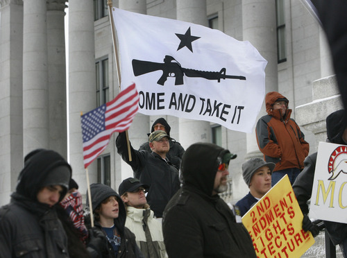 Scott Sommerdorf   |  Tribune file photo
Carl Jessop, of Eagle Mountain, holds a "Come and take it" flag as he and about 200 other gun-rights activists rallied at the Utah Capitol as part of the "National Day of Resistance" Saturday, February 23, 2013.
