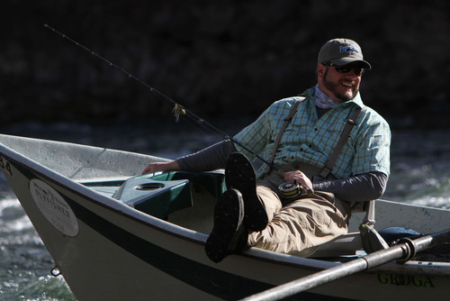 Francisco Kjolseth  |  The Salt Lake Tribune
Tribune outdoor writer Brett Prettyman floats down the Green River while reporting a story for "Utah Bucket List."  The KUED program and Prettyman won an award in the 2014 Outdoor Writers Association of America Contest.