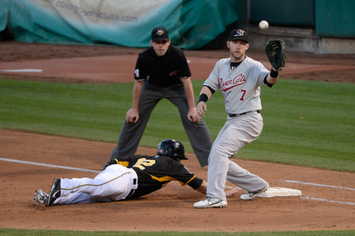 Francisco Kjolseth  |  The Salt Lake Tribune
Tommy Field of the Salt Lake Bees slides back to first ahead of Daric Barton of the Sacramento River Cats at Smith's Ballpark on Thursday, June 5, 2014.