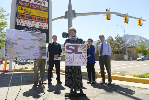 Leah Hogsten  |  The Salt Lake Tribune
East Millcreek Community Council Chairwoman Nancy Carlson-Gotts thanks UDOT and county officials for the new pedestrian signal installed at 2940 E. 3300 South. The press conference about the signal kicked off a campaign for road safety efforts in Salt Lake County's unincorporated areas, Thursday, June 5, 2014.