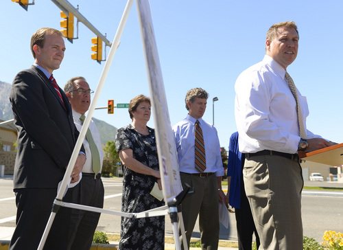 Leah Hogsten  |  The Salt Lake Tribune
l-r Ben McAdams, Sam Granato, Nancy Carlson-Gotts, Patrick Leary listen as UDOT regional director Nathan Lee talks about the new improvements for transportation and safety throughout the county. A new pedestrian signal installed at 2940 East 3300 South kicked off a campaign for road safety efforts in Salt Lake County's unincorporated areas, Thursday, June 5, 2014.