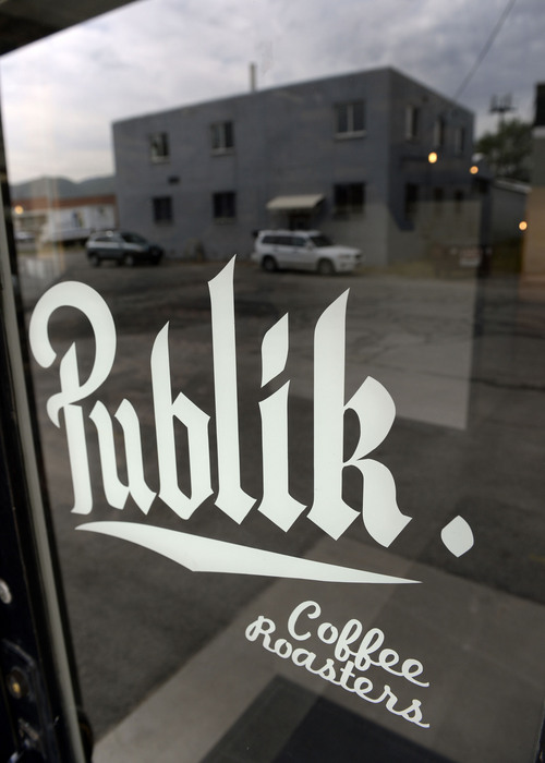 Al Hartmann  |  The Salt Lake Tribune
Just-opened Publik Coffee Roasters at 975 S. West Temple. The refurbished building used to be a print shop. Beans from around the world are shipped in and roasted in a high-tech computerized roaster. It's a two-story building and one can look down on the main floor from the upper seating area that has Wi-Fi and meeting rooms. The menu is all toast using Utah-made bread with different toppings: from butter and jam to avocado.