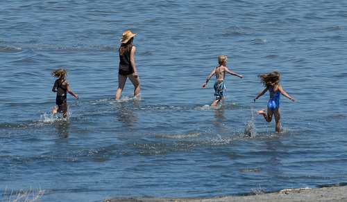 Francisco Kjolseth  |  The Salt Lake Tribune
Running along the clear waters of The Great Salt Lake, Lauren Jones, 7, Stephanie and Ben, 8, McMillan and Emmi Bloomquist, 7, from left, enjoy the cool temperatures of the water on Thursday, June 5, 2014.