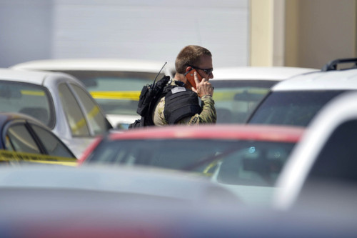 Chris Detrick  |  The Salt Lake Tribune
The scene at a West Haven auto body shop Wednesday June 4, 2014. Negotiations with a suspect barricaded in West Haven auto body shop broke down Wednesday at about 3 p.m., SWAT members entered the building and shots were fired, the Weber County Sheriff's Office reported.Weber County Sheriff's Sgt. Lane Findlay had said the suspect, wanted on several drug-related and evading police felony warrants, was initially located at the shop, near 1900 S. 1100 West in West Haven City, about 10:30 a.m.