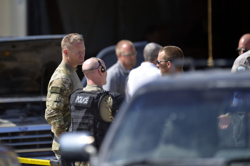 Chris Detrick  |  The Salt Lake Tribune
The scene at a West Haven auto body shop Wednesday June 4, 2014. Negotiations with a suspect barricaded in West Haven auto body shop broke down Wednesday at about 3 p.m., SWAT members entered the building and shots were fired, the Weber County Sheriff's Office reported.Weber County Sheriff's Sgt. Lane Findlay had said the suspect, wanted on several drug-related and evading police felony warrants, was initially located at the shop, near 1900 S. 1100 West in West Haven City, about 10:30 a.m.