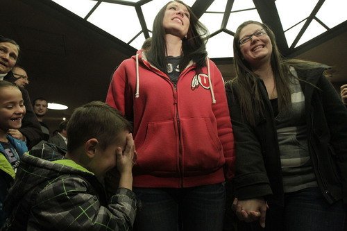 Leah Hogsten  |  The Salt Lake Tribune
l-r Chantel Buhler and spouse Laura Fernandez  giggle at their son Kayson, 4, after the two were officially married by the Rev. Curtis L. Price in the lobby of the Salt Lake County offices, Friday December 20, 2013. Several hundred people descended on the Salt Lake County Clerkís Office Friday afternoon to get licenses. U.S. District Court Judge Robert J. Shelby in Utah Friday struck down the stateís ban on same-sex marriage, saying the law violates the U.S. Constitutionís guarantees of equal protection and due process.