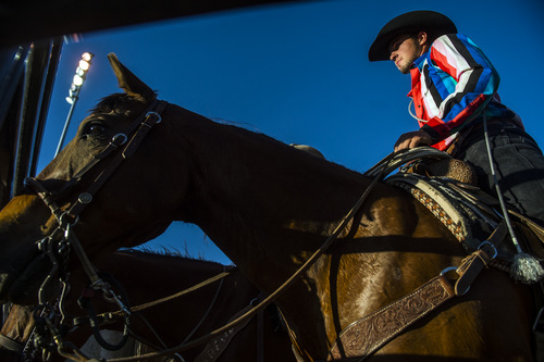 Chris Detrick  |  The Salt Lake Tribune
Dalton Rydalch watches other cowboys compete after competing in tie-down roping during the Utah State High School Rodeo Association Finals at the Wasatch County Event Center in Heber City Thursday June 5, 2014.
