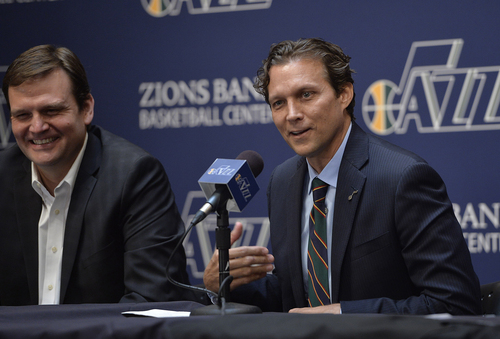 Scott Sommerdorf   |  The Salt Lake Tribune
Quin Snyder smiles as he answers a question. Jazz GM Dennis Lindsey is at left. The Utah Jazz introduced Quin Snyder as their new head coach, Saturday, June 7, 2014.