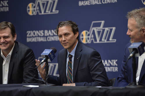 Scott Sommerdorf   |  The Salt Lake Tribune
Quin Snyder smiles as he answers a question. Jazz GM Dennis Lindsey is at left, and Jazz CEO Greg Miller is at right. The Utah Jazz introduced Quin Snyder as their new head coach, Saturday, June 7, 2014.