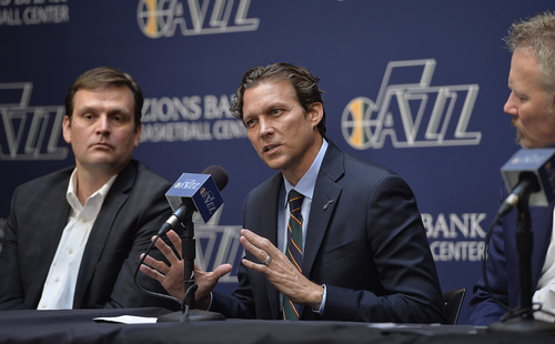 Scott Sommerdorf   |  The Salt Lake Tribune
Quin Snyder gestures as he answers a question. Jazz GM Dennis Lindsey is at left, and Jazz CEO Greg Miller is at right. The Utah Jazz introduced Quin Snyder as their new head coach, Saturday, June 7, 2014.