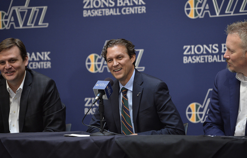 Scott Sommerdorf   |  The Salt Lake Tribune
Quin Snyder smiles as he answers a question. Jazz GM Dennis Lindsey is at left, and Jazz CEO Greg Miller is at right. The Utah Jazz introduced Quin Snyder as their new head coach, Saturday, June 7, 2014.
