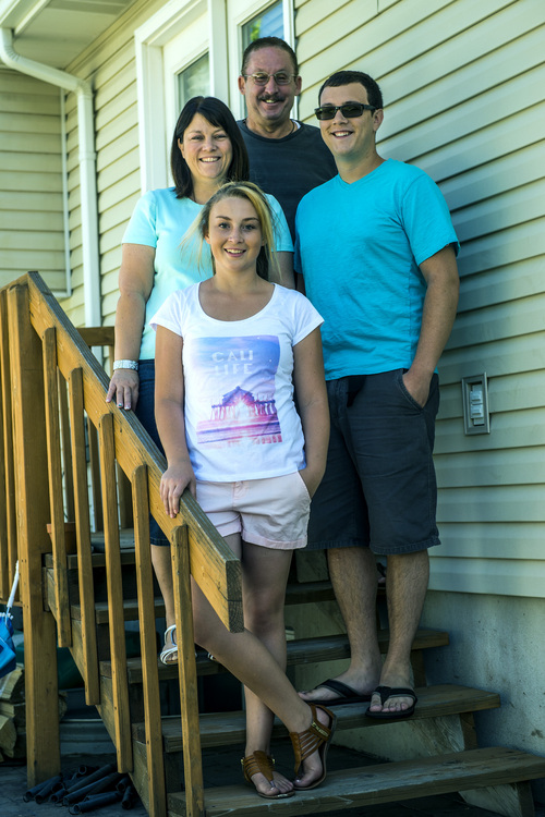 Chris Detrick  |  The Salt Lake Tribune
Shannon Johnson, 14, poses for a portrait with her parents; Vickie and Carter and her brother Steven LaFollette, 22, at their home in Syracuse Saturday May 31, 2014. On June 12, local Syracuse, UT resident and leukemia survivor Shannon Johnson, 14, and her mother will be in Washington, D.C., along with other blood cancer patients and marrow advocates, to urge continued federal support and funding for Be The Match, a nonprofit that connects patients with their donor match for a life-saving marrow or umbilical cord blood transplant.