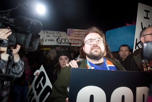 Tribune file photo
Director Kevin Smith and supporters holds signs as they face off with protesters before the premiere of his movie "Red State", at the Eccles Theater, during Sundance Film Festival in Park City, Sunday, Jan. 23, 2011.