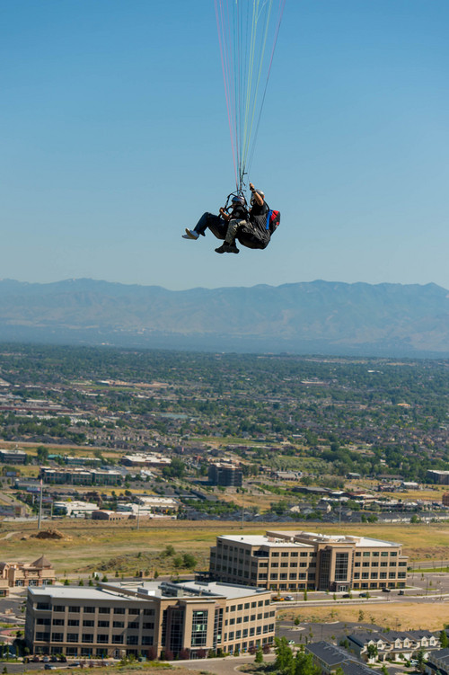 Trent Nelson  |  The Salt Lake Tribune
Mike Semanoff and Sgt. Jesus Ruiz paraglide as part of "Wings of Inspiration", an even created by Mike Semanoff to allow wounded and disable veterans to experience the thrill of flight, at the Point of the Mountain in Draper, Saturday June 7, 2014.