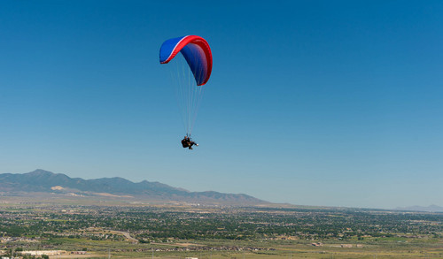 Trent Nelson  |  The Salt Lake Tribune
Mike Semanoff and Sgt. Jesus Ruiz paraglide as part of "Wings of Inspiration", an even created by Mike Semanoff to allow wounded and disable veterans to experience the thrill of flight, at the Point of the Mountain in Draper, Saturday June 7, 2014.