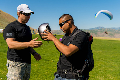 Trent Nelson  |  The Salt Lake Tribune
Mike Semanoff helps Sgt. Jesus Ruiz suit up before paragliding as part of "Wings of Inspiration", an even created by Semanoff to allow wounded and disable veterans to experience the thrill of flight, at the Point of the Mountain in Draper, Saturday June 7, 2014.