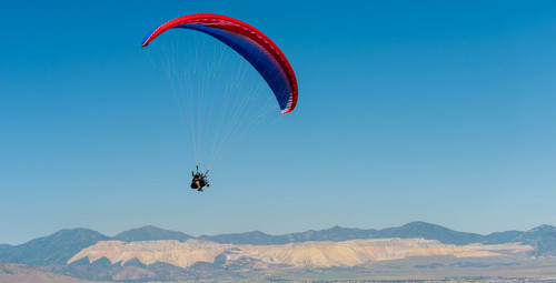 Trent Nelson  |  The Salt Lake Tribune
Mike Semanoff and Sgt. Jesus Ruiz paraglide as part of "Wings of Inspiration," an even created by Mike Semanoff to allow wounded and disable veterans to experience the thrill of flight, at the Point of the Mountain in Draper on Saturday.
