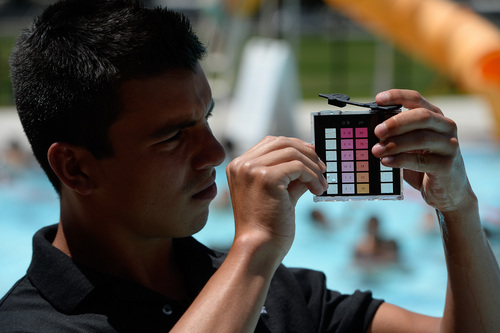 Francisco Kjolseth  |  The Salt Lake Tribune
The Salt Lake County Health Department holds its annual healthy swimming season media kickoff at the Redwood Recreation Center as pool manager Avonte King-Henry checks the PH and chlorine levels in the pool in West Valley City. The event on Tuesday was held as a reminder to residents to practice healthy swimming behaviors, especially implementing good hygiene habits and not visiting the pool while ill with diarrhea.