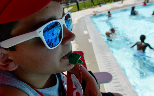 Francisco Kjolseth  |  The Salt Lake Tribune
Life guard Jaren Eccles keeps an eye on kids as the Salt Lake County Health Department holds its annual healthy swimming season media kickoff at the Redwood Recreation Center in West Valley City on Tuesday, June 10, 2014. The event was held as a reminder to residents to practice healthy swimming behaviors, especially implementing good hygiene habits and not visiting the pool while ill with diarrhea.