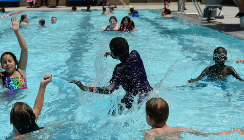 Francisco Kjolseth  |  The Salt Lake Tribune
The Salt Lake County Health Department holds its annual healthy swimming season media kickoff as kids play at the Redwood Recreation Center in West Valley City to remind residents to practice healthy swimming behaviors, especially implementing good hygiene habits and not visiting the pool while ill with diarrhea.