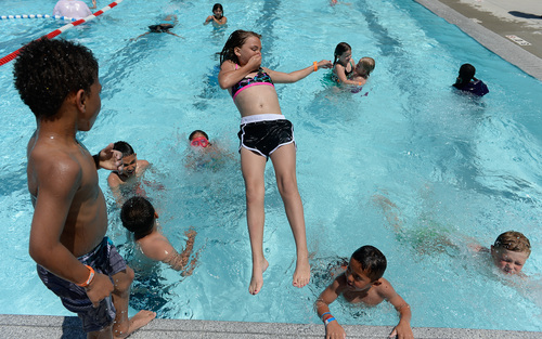 Francisco Kjolseth  |  The Salt Lake Tribune
The Salt Lake County Health Department holds its annual healthy swimming season media kickoff on Tuesday, June 10, 2014, as kids play at the Redwood Recreation Center in West Valley City to remind residents to practice healthy swimming behaviors, especially implementing good hygiene habits and not visiting the pool while ill with diarrhea.