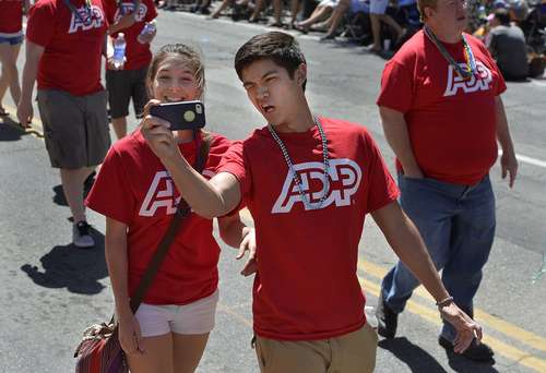 Scott Sommerdorf   |  The Salt Lake Tribune
Participants in the ADP entry make a "selfie" during the Salt Lake City Pride Parade, Sunday, June 7, 2014.