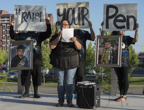 Steve Griffin  |  The Salt Lake Tribune


Cencira Te'o reads a letter from, Moana Uluave, a class mate, Siale Angilau, who was shot and killed in the Salt Lake City federal courthouse, during the Justice4Siale Vigil on the courthouse plaza in Salt Lake City, Utah Wednesday, June 11, 2014.  Glendale community members have organized a coalition called "Raise your Pen Coalition."