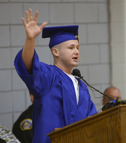 Al Hartmann  |  The Salt Lake Tribune
Inmate and student speaker Paul Adler gives a spirited message to the graduating class at the Utah State Prison in Draper Wednesday June 11, 2014. Two hundred seventy-three male and female inmates received their high school diplomas.
