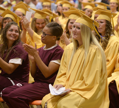 Al Hartmann  |  The Salt Lake Tribune
Inmates applaud student speaker Trista Chandara, right, during a graduation excercise at the Utah State Prison in Draper Wednesday June 11, 2014.  Two hundred seventy-three male and female inmates received their high school diplomas.