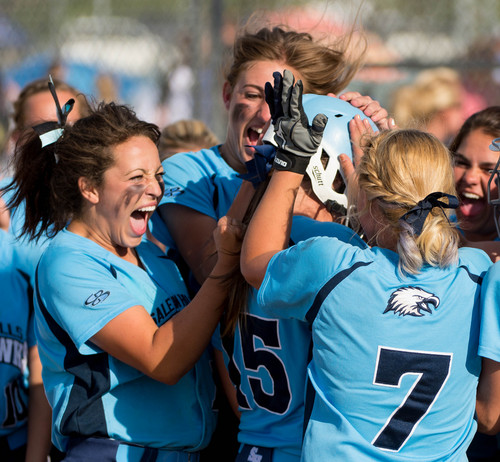 Trent Nelson  |  The Salt Lake Tribune
Salem Hills players celebrate a home run by Kirtlyn Bohling as they defeat Bonneville in the first game of the 4A softball state championship, Thursday May 22, 2014.